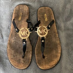 Black and gold sandals, slightly worn